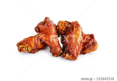Crispy and flavorful chicken wings served on a white background Crispy and flavorful chicken wings served on a white background 132842518
