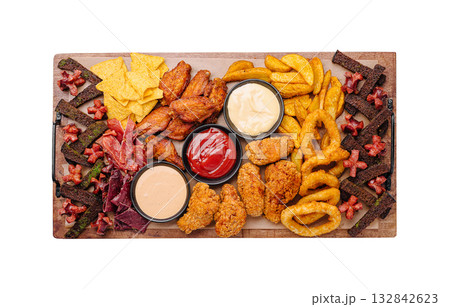 Tasty platter of fried snacks and dips served at a gathering Tasty platter of fried snacks and dips served at a gathering 132842623