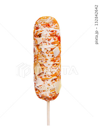Delicious cheese covered corn dog treat on a stick enjoyed at a summer festival Delicious cheese covered corn dog treat on a stick enjoyed at a summer festival 132842642