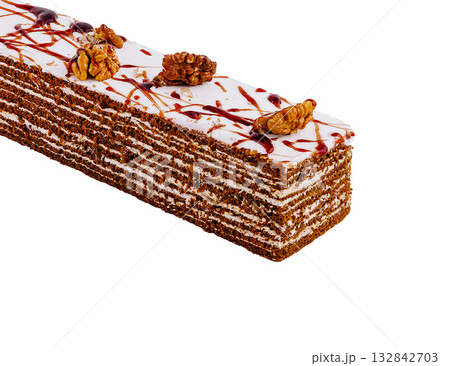 Delicious honey cake standing on white background 132842703