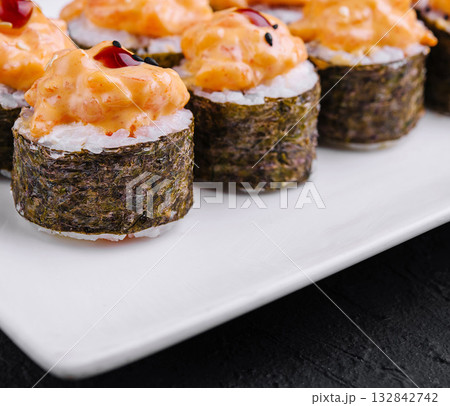 Delicious spicy tuna sushi rolls on white plate Delicious spicy tuna sushi rolls on white plate 132842742