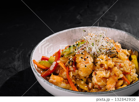 Gourmet shrimp fried rice in elegant bowl Gourmet shrimp fried rice in elegant bowl 132842910