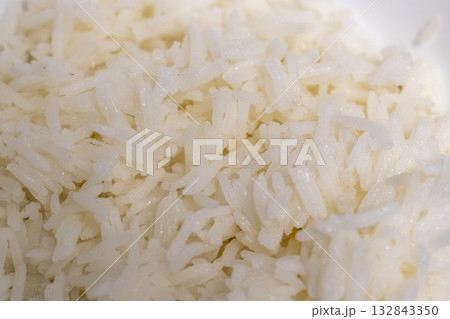 Close up shot of the cooked white rice in the bowl Close up shot of the cooked white rice in the bowl 132843350