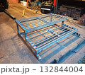 A welded structure of a small ladder made of metal angles and reinforcement. 132844004