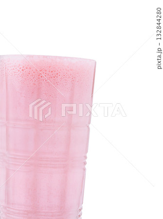 Refreshing pink drink served in a transparent cup at a summertime gathering 132844280