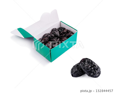 Enjoy dried plums in a colorful box for healthy snacking options 132844457