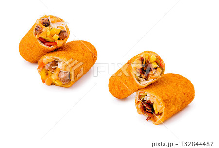Delicious crispy rolled tacos filled with savory meats and fresh vegetables Delicious crispy rolled tacos filled with savory meats and fresh vegetables 132844487