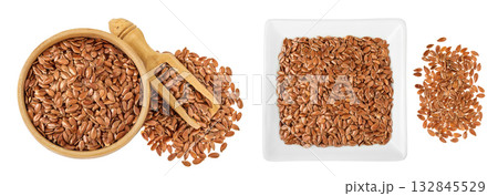 flaxseed in wooden bowl isolated on white background. Top view. Flat lay 132845529