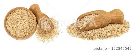 Sesame seeds in wooden bowl and scoop isolated on white background. Top view. Flat lay Sesame seeds in wooden bowl and scoop isolated on white background. Top view. Flat lay 132845545