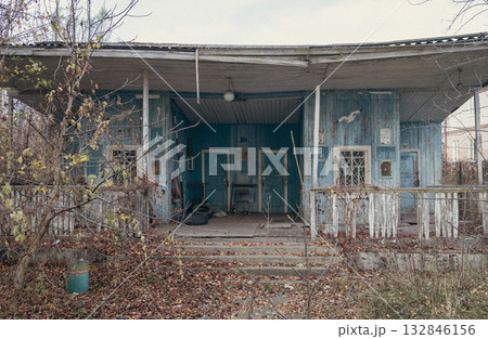 Old abandoned wooden house boat station blue color. 132846156