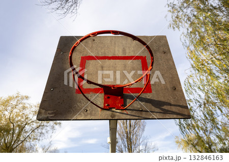 A basketball hoop on an outdoor sports ground A basketball hoop on an outdoor sports ground 132846163