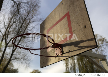 A basketball hoop on an outdoor sports ground 132846165