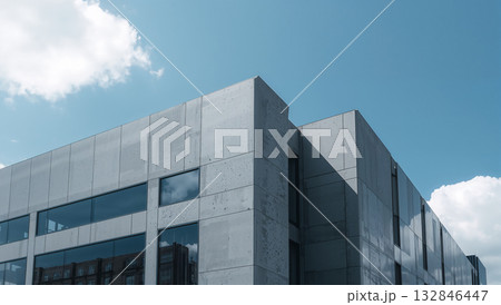 Modern architecture with a minimalist design against a bright blue sky 132846447