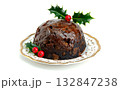 Christmas pudding with holly berries on a white background. Traditional festive food. Copy space. 132847238