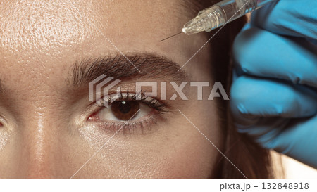 Forehead injection as aesthetic correction by professional dermatologist Forehead injection as aesthetic correction by professional dermatologist 132848918