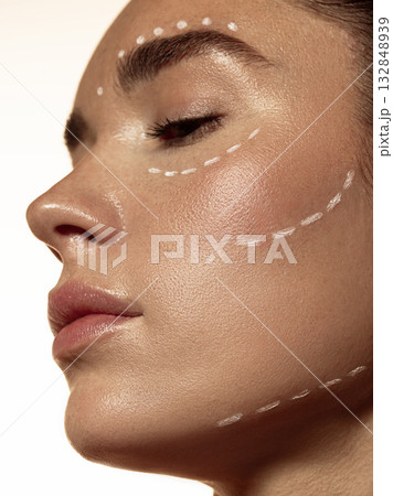Side view of woman face with facial contour marking before dermatologic procedure 132848939