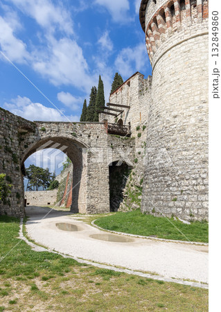 Entrance of Brescia Castle with drawbridge arches and limestone walls near Torre dei Prigionieri 132849860