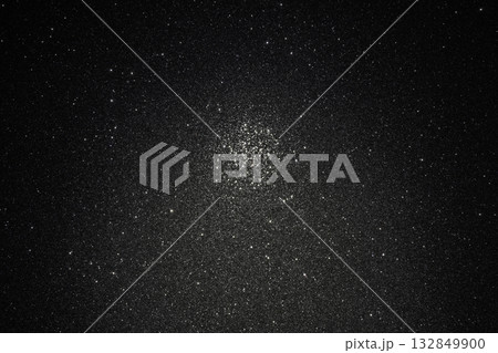 Dark granular background with asphalt like relief and scattered sparkles, focus highlights central Dark granular background with asphalt like relief and scattered sparkles, focus highlights central 132849900