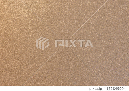 Warm beige glitter texture with golden highlights in macro view showing delicate even shimmer Warm beige glitter texture with golden highlights in macro view showing delicate even shimmer 132849904