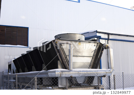 Industrial metal cooling unit with ventilation fans and factory building 132849977
