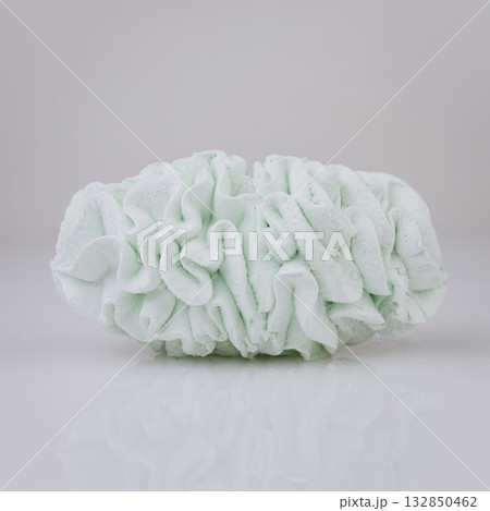 Mint green zephyr marshmallow dessert on white background, minimal sweet concept Mint green zephyr marshmallow dessert on white background, minimal sweet concept 132850462