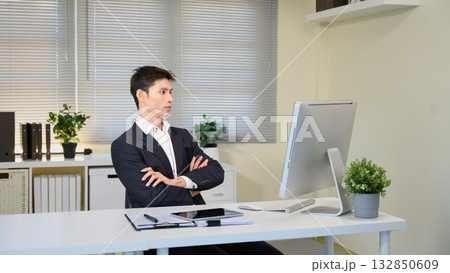 Businessman using computer in office workplace 132850609