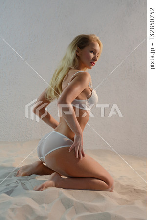 Beauty woman with angel wings in a studio setting 132850752