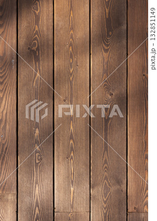 Warm brown vertical wooden planks with subtle grain texture and shadow patterns 132851149