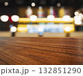 Table top wooden counter with lighting Bar interior Blur background 132851290