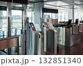 Automated airport gate at modern airport for scanning boarding pass. Concept of digitalization, self-check-in and independent travel. 132851340
