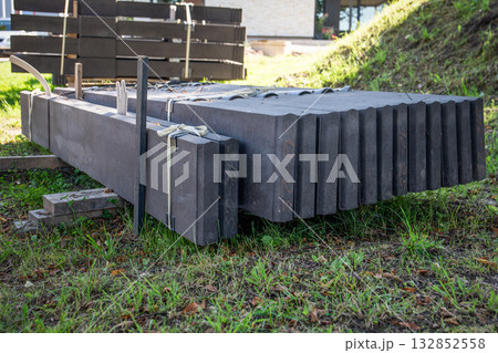 Large precast concrete blocks stacked and tied together at a construction site Large precast concrete blocks stacked and tied together at a construction site 132852558