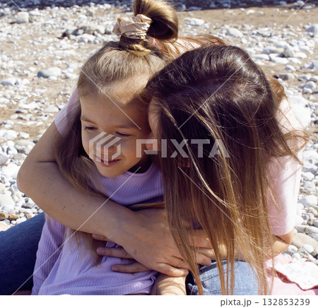 mother with twins daughters on beach mother with twins daughters on beach 132853239