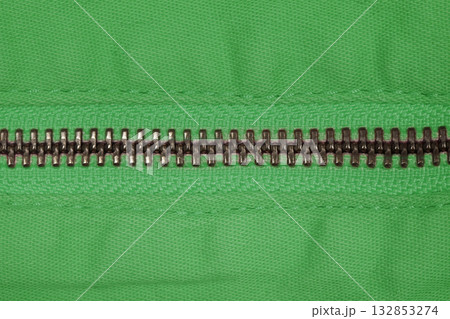 Zipper of green jeans. Close-up of women's jeans, jeans with a zipper. Jeans concept, casual wear concept. 132853274