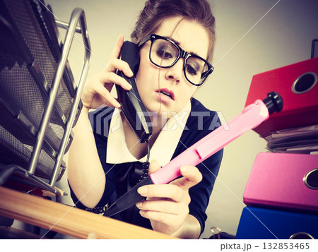 Sleepy business woman in office working 132853465