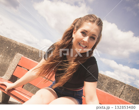 Happy teenager woman outside. 132853480