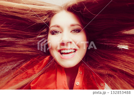 Happy positive woman with long brown hair 132853488