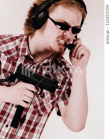 Gamer man shooting from gun 132853500