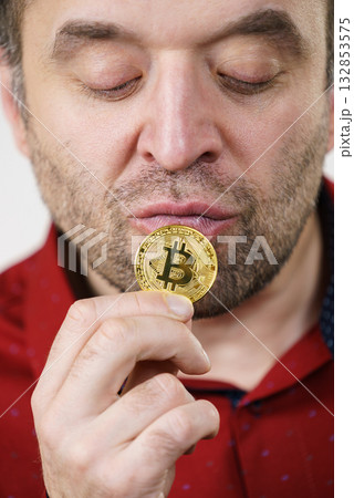 Man having bitcoin coin 132853575