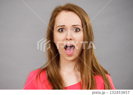 Shocked and surprised woman 132853657