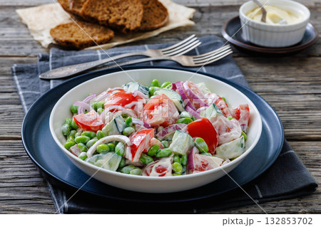 creamy tomato cucumber edamame bean onion salad creamy tomato cucumber edamame bean onion salad 132853702