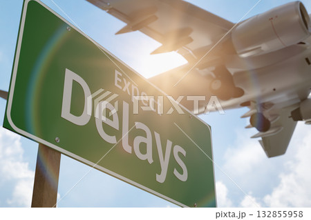 Expect Delays Green Road Sign with Airplane Above. 132855958