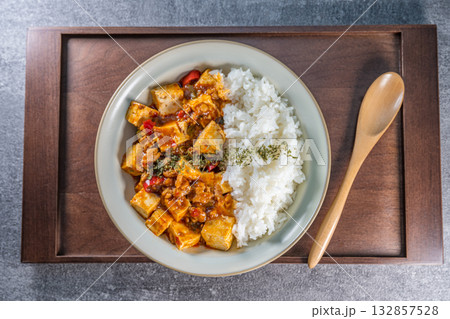 Mapo Tofu Rice Bowl (Mapo Doufu Fan), a popular and spicy Chinese dish from Sichuan province. Mapo Tofu Rice Bowl (Mapo Doufu Fan), a popular and spicy Chinese dish from Sichuan province. 132857528