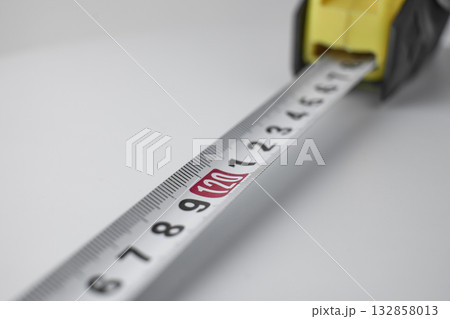 Close up of a marked measuring tape. High quality photo Close up of a marked measuring tape. High quality photo 132858013