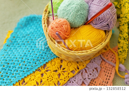 Natural basket of colorful yarn and crochet hooks Natural basket of colorful yarn and crochet hooks 132858512