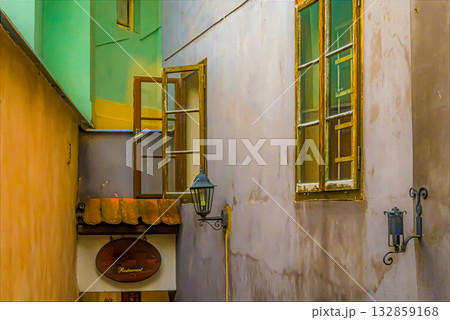 Charming alleyway with open windows and restaurant sign Charming alleyway with open windows and restaurant sign 132859168