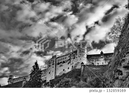 Historic castle on a hill under dramatic sky Historic castle on a hill under dramatic sky 132859169