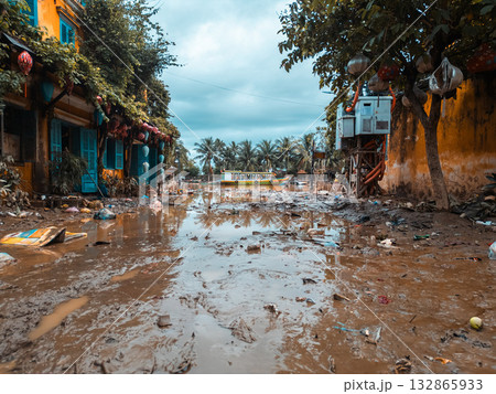 flooded city or town with buildings submerged in overflow water and mud, village underwater after heavy tropical rain and typhoon, consequences with dirt on the street flooded city or town with buildings submerged in overflow water and mud, village underwater after heavy tropical rain and typhoon, consequences with dirt on the street 132865933