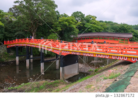 people walk on arching bridge by Kurehashi Bridge of Usa Shrine, Oita 132867172
