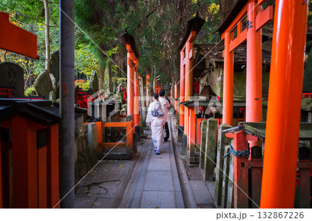 couple in kimono at torii gates and shrine of Fushimi Inari in autumn, Kyoto couple in kimono at torii gates and shrine of Fushimi Inari in autumn, Kyoto 132867226