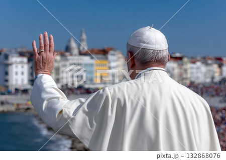 Papal figure raising hand to crowd by the seashore during a public event in coastal town 132868076